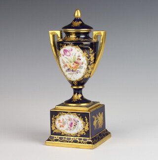 An Austrian blue and gilt 2 handled vase decorated with spring flowers, raised on a square plinth 20cm 