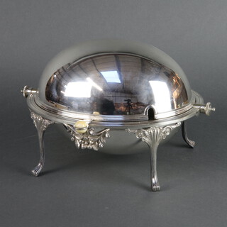 A silver plated breakfast server raised on splayed legs and retracting cover 