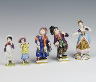 A pair of German porcelain figures of street urchins raised on square bases 11cm (both chipped), a pair of figures of a boy and girl 7cm together with a figure of a dancer 11cm 