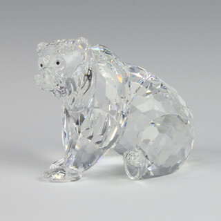 A Swarovski Crystal figure of a seated brown bear 8cm, boxed