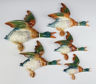 A matched set of Beswick flying ducks 3 marked 596/1/2/3/4, the large other unmarked, 25cm, 20cm, 17cm and 13cm, unmarked duck 29cm  