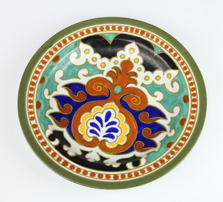 A Gouda Pottery Paola Royal plate decorated with scrolls 29cm 