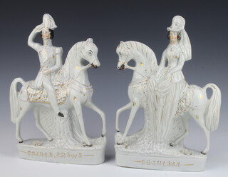 A pair of Victorian Staffordshire figures on horse back of Prince Frederick William of Prussia and The Princess Royal with gilt decoration 34cm 