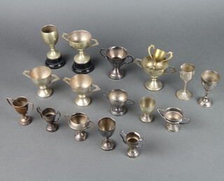 A quantity of silver plated miniature trophy cups 