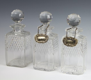 A set of 3 square cut glass spirit decanters and stoppers 24cm 