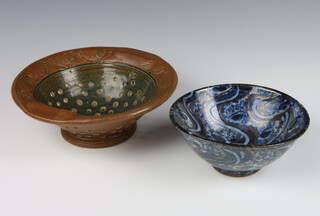 A Studio Pottery bowl with pierced and incised decoration by A & J Young 24cm together with a deep bowl with wavy decoration by Robert Goldsmith 18cm 