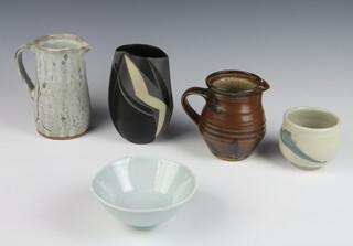 A Studio Pottery jug by Andrew Marshall 16cm, 1 other jug, a white blue glazed vase by Joana Wason, a vase and a bowl - various makers 