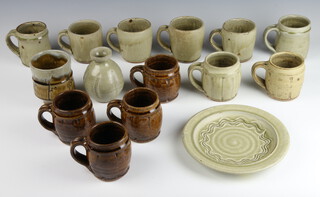 A Studio Ceramics dish by Mike Dodd 20cm, 13 Mike Dodd mugs and a beaker vase 