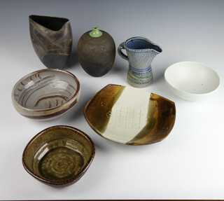 A Studio Pottery stylish dish by Bruce Chivers 25cm, a ditto bowl by Terry Bell Hughes 20cm, a ribbed bowl by Jane Hamlyn, a vase and a stylish jug by Walter Keeler a white glazed bowl by J Constantinides
