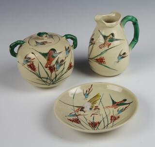 A 1920's Japanese sugar bowl and cover decorated with insects, ditto jug and saucer 
