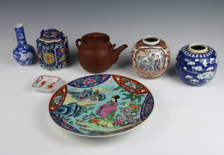 A 20th Century Chinese famille rose plate decorated with panels of flowers 30cm, a tanware teapot, 1 other teapot, 2 ginger jars, vase and dish 