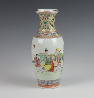 A 20th Century Chinese famille rose vase decorated with figures in a garden setting and script 25cm 