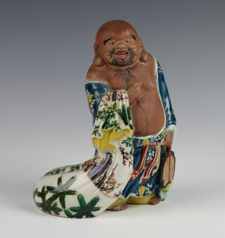 A Chinese glazed figure of a standing Hotei 20cm 