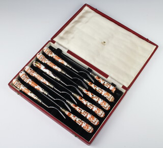 A cased set of Royal Crown Derby style porcelain handled steak knives for six contained in an Asprey fitted case 