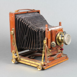 A Houghton half plate "Triple Victo" field camera with Thornton Pickard roller blind shutter