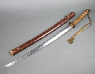 A 1930's, World War Two Japanese Company officers Shin Gunto (military sword), the blade 68cm long including copper collar, the Tsuba decorated blossoms and hearts with the o-seppas having pierced hearts,  the Tang with 7 character mark and V-shaped file mark pattern, the standard bound pommel decorated blossoms with brown and blue dress knot attached to the buttcap, the scabbard of black lacquered wood with removable leather cover attached by two press studs