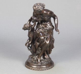 A bronze figure group of Venus and Cupid, raised on a circular base 54cm h x 24cm diam. 
