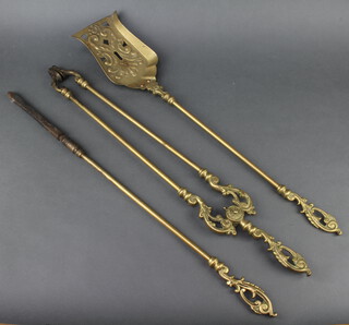 A Victorian style brass 3 piece fireside companion set with poker, tongs and shovel 