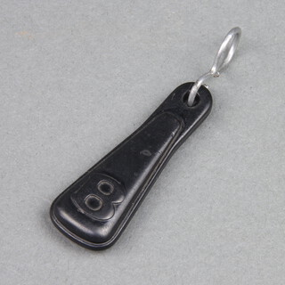 A black plastic key fob for a Bentley 8, 6cm x 2cm 