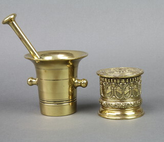 A 17th/18th Century twin handled bell metal mortar, the base marked 9 11cm x 7cm together with an associated pestle and a Victorian cylindrical embossed string box  