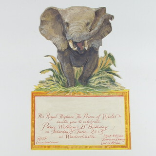 Of Royal Interest, a private cut out invitation card from HRH The Prince of Wales for Prince William's 21st Birthday Party, to be held on 21st June 2003 at Windsor Castle 7.30 for 8.15 o'clock, dinner and dancing, Out of Africa.  The top half of the card depicting a bull elephant charging through long grass, the bottom half a square gilded box with the invitation text, designed by Alex Cobbe approx. 17cm wide x 26cm high 
