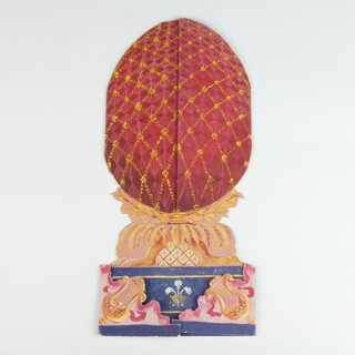 Of Royal Interest, a cut out menu card for a dinner at Windsor Castle 28th February 2003, the card in the form of Faberge egg mounted on a plinth supported by lyres, the egg opening to reveal the menu within approx. 14cm wide x 30cm high 