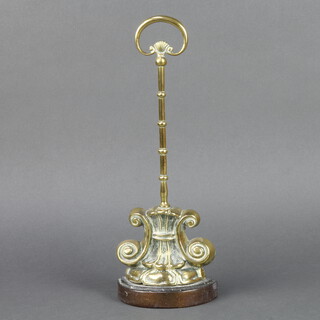 A Victorian shaped brass doorstop with scroll base 38cm h x 13cm w x 6cm d 