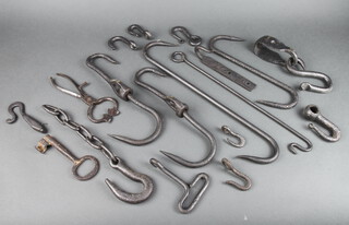 A pair of 19th Century polished steel sugar cutters, an iron sack hook, an iron key, 2 19th Century butchers hooks and other iron hooks 