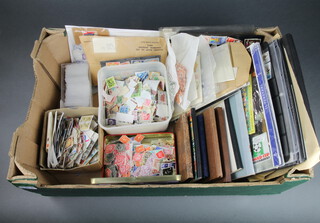 A box of loose stamps, GB first day covers etc 
