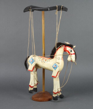 A wooden articulated puppet horse 30cm h x 26cm w x 5cm d 