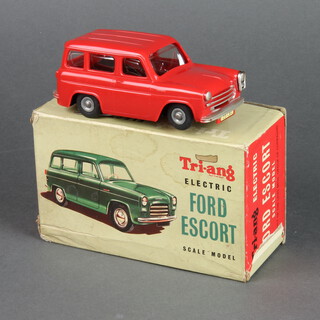 A Tri-ang electric model of a Ford Escort boxed, together with a 973 Dinky Super goods train boxed  