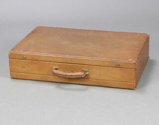 A stylish leather suitcase 15cm h x 64cm w x 45cm d 