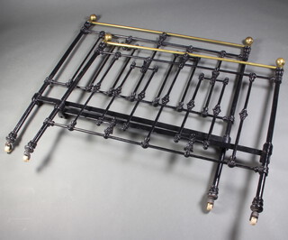 A Victorian iron and brass bedstead complete with rails and base 135cm long x approx. 197cm w 