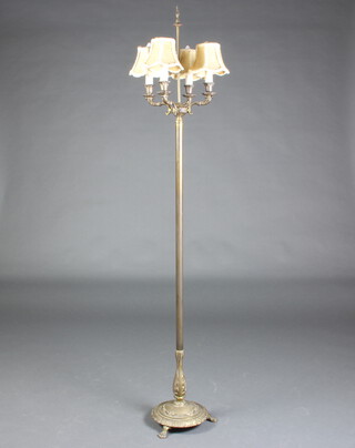 A gilt metal 4 light standard lamp raised on a circular base with paw feet 171cm h x 29cm w 