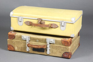 A yellow aluminium Aviator suitcase with leather handle (slight damage) 17cm x 61cm x 36cm together with a Revelation naval green fibre and leather bound suitcase 17cm x 61cm x 38cm d  