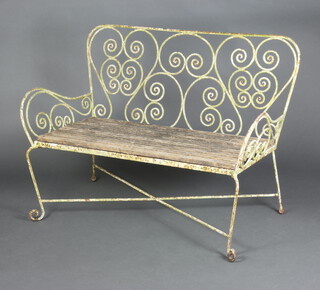 A wrought iron garden bench with wooden slatted seat 95cm h x  113cm w x 60cm (seat 107cm w x 45cm d)