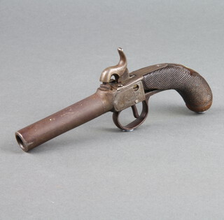A 19th Century percussion pocket pistol with 7cm barrel, wooden chequer carved grip (slight damage to grip) 