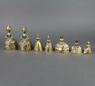 7 various brass table bells in the form of crinoline ladies 15cm h - 8cm h 