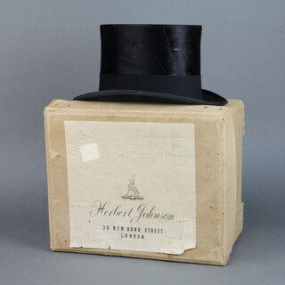 A gentleman's black silk top hat by Trees & Co London size 7 1/8 contained within a Herbert Johnson cardboard box 