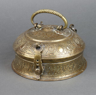A circular Eastern embossed brass spice box 10cm h x 21cm 