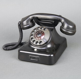 A vintage Continental dial telephone, the base marked 9FG Tistb5 
