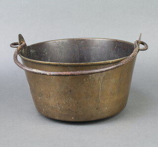 A 19th Century brass preserving pan with iron swing handle 17cm x 28cm 