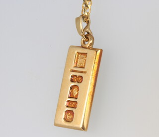 A 9ct yellow gold ingot pendant and chain 10.6 grams 