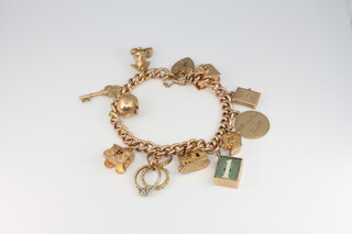 A 9ct yellow gold charm bracelet, gross weight 54.7 grams 