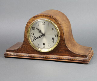 A 1930's 8 day striking mantel clock with silvered dial and Arabic numerals contained in an oak Admiral's hat shaped case complete with pendulum (no key) 24cm x 41cm x 15cm d 