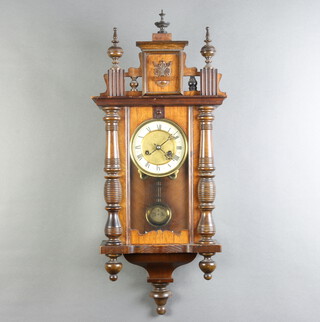 A 19th Century Vienna style striking on gong regulator with 30cm enamelled dial, Roman numerals and gridiron pendulum, complete with key and pendulum, contained in a walnut case 73cm h x 30cm w x 16cm d 
