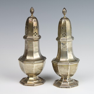 A pair of octagonal silver sugar shakers of Queen Anne style, Birmingham 1924, 18cm, 176 grams 