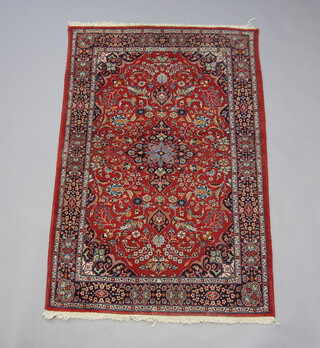 A red and blue ground Sarourgh rug with central medallion 186cm x 124cm 