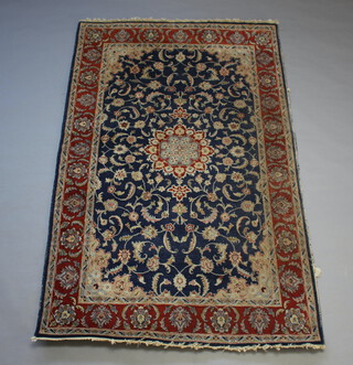 A blue and white ground Northwest Persian rug, floral patterned within a 3 row border 224cm x 140cm 