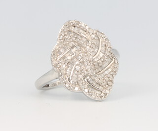 A 9ct white gold baguette diamond cocktail ring, size P 1/2, 4 grams